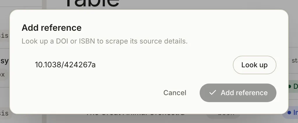The Add reference window: Look up a DOI or ISBN to scrape its source details, with 10.1038/424267a typed, Look up, Cancel and Add reference buttons.