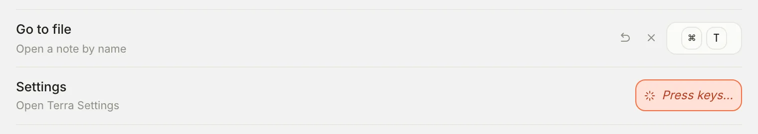 Two rows of Settings, Hotkeys. Go to file now shows Command T, with Reset to default and Unbind buttons beside it. Settings shows Press keys….